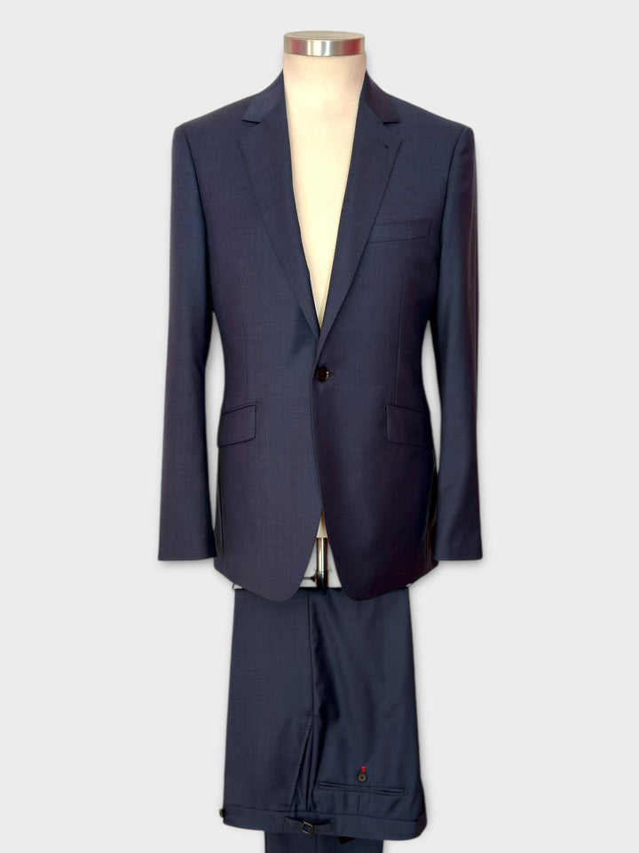 Navy blue suit on a mannequin against a white background